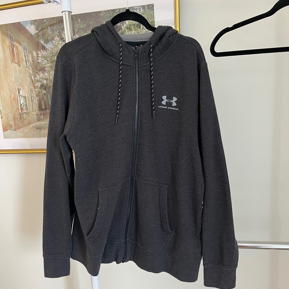 Man zip up under Armour sweatshirt